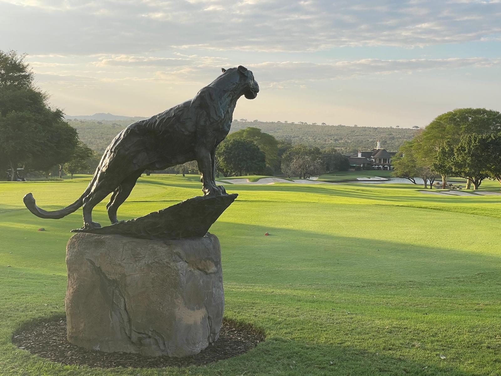 Bronze leopard statue overlooking the fairway